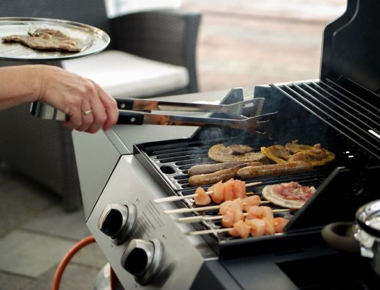 Grilling on a propane grill during spring